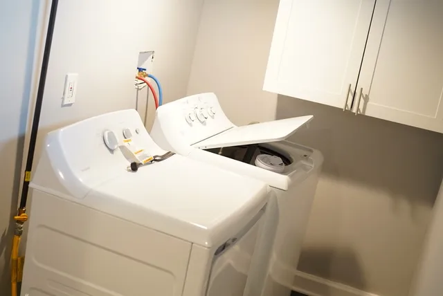 a view of a house with a yard and deck