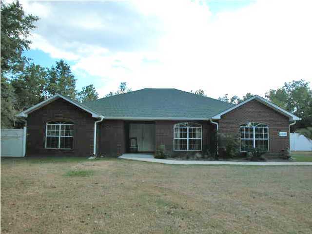 4246 Edge Perry Road Crestview, FL 32539 - Photo 2 of 20 front view of a house with a yard