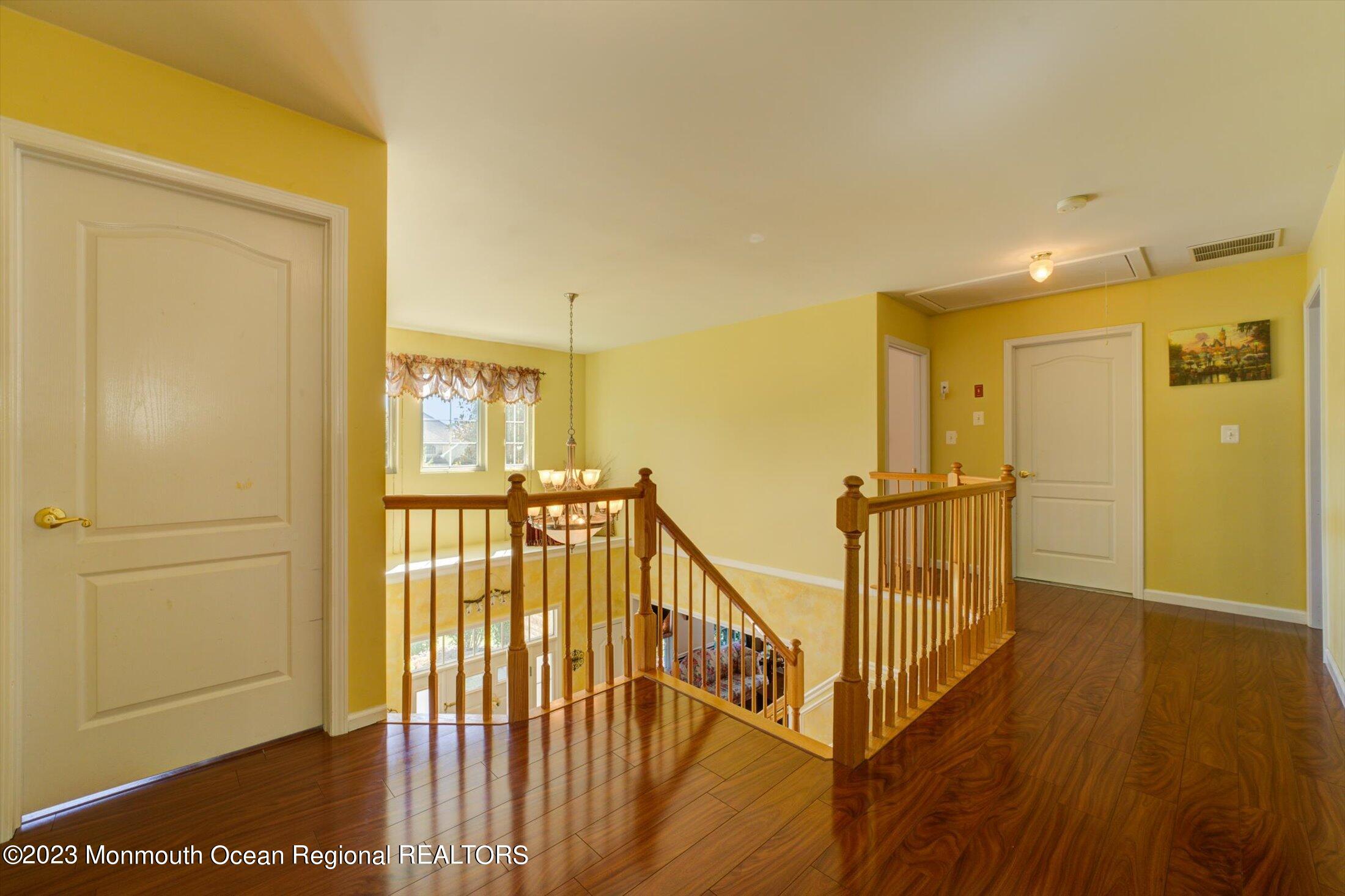 22 Rodeo Drive Jackson, NJ 08527 - Photo 15 of 42 a view of a hallway with wooden floor and windows