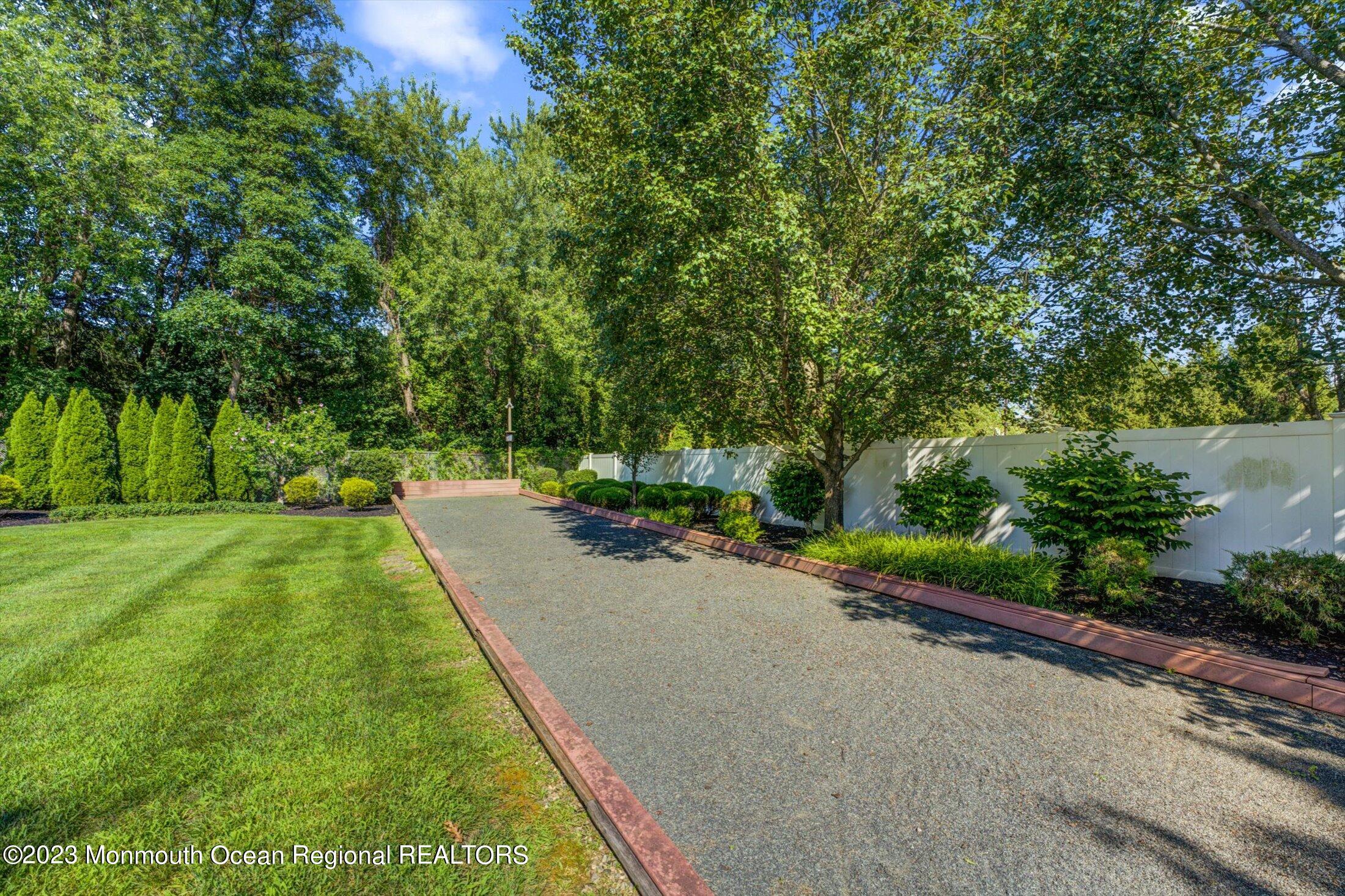 22 Rodeo Drive Jackson, NJ 08527 - Photo 35 of 42 a view of a street with a yard and large trees