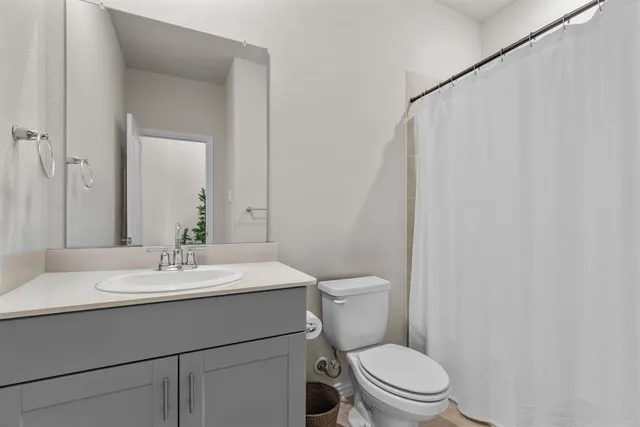 a bedroom with a bed and with furniture