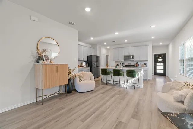 a living room with furniture and a table