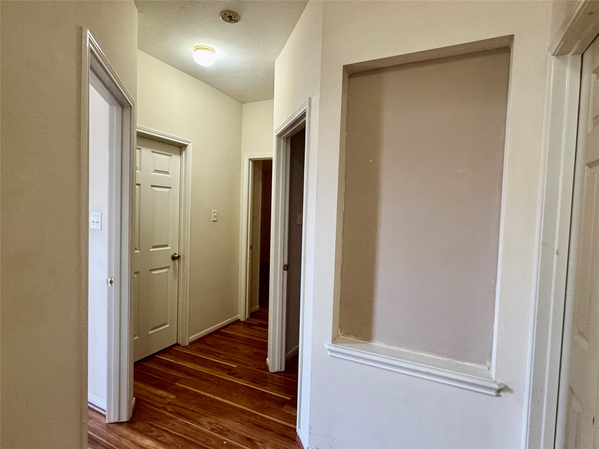 13113 Sunset Cliff Court Sugar Land, TX 77478 - Photo 16 of 22 a view of a hallway with wooden floor and closet area