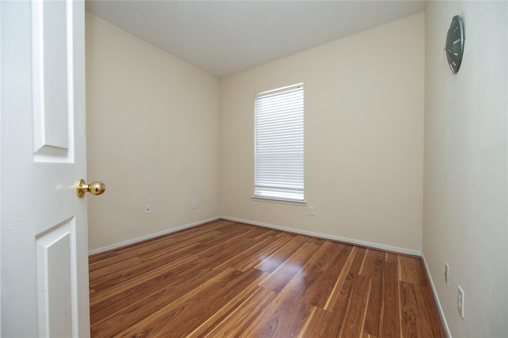 13113 Sunset Cliff Court Sugar Land, TX 77478 - Photo 19 of 22 a view of room with window and wooden floor