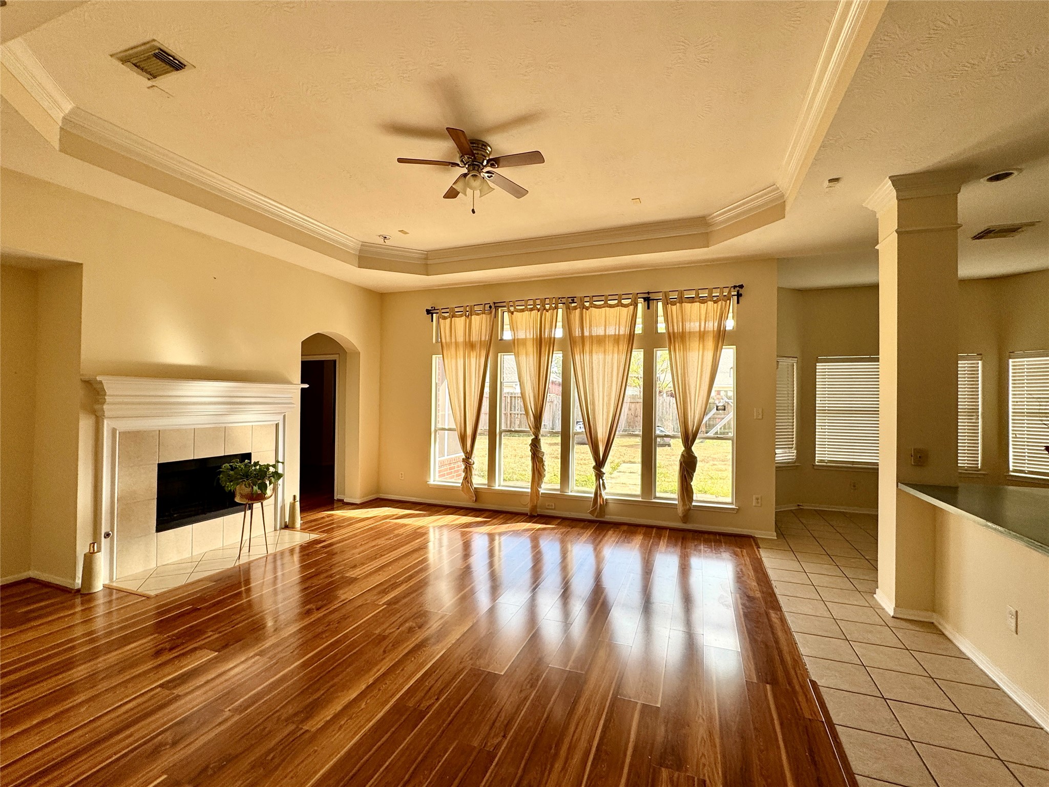 13113 Sunset Cliff Court Sugar Land, TX 77478 - Photo 6 of 22 a view of an empty room with wooden floor and a window