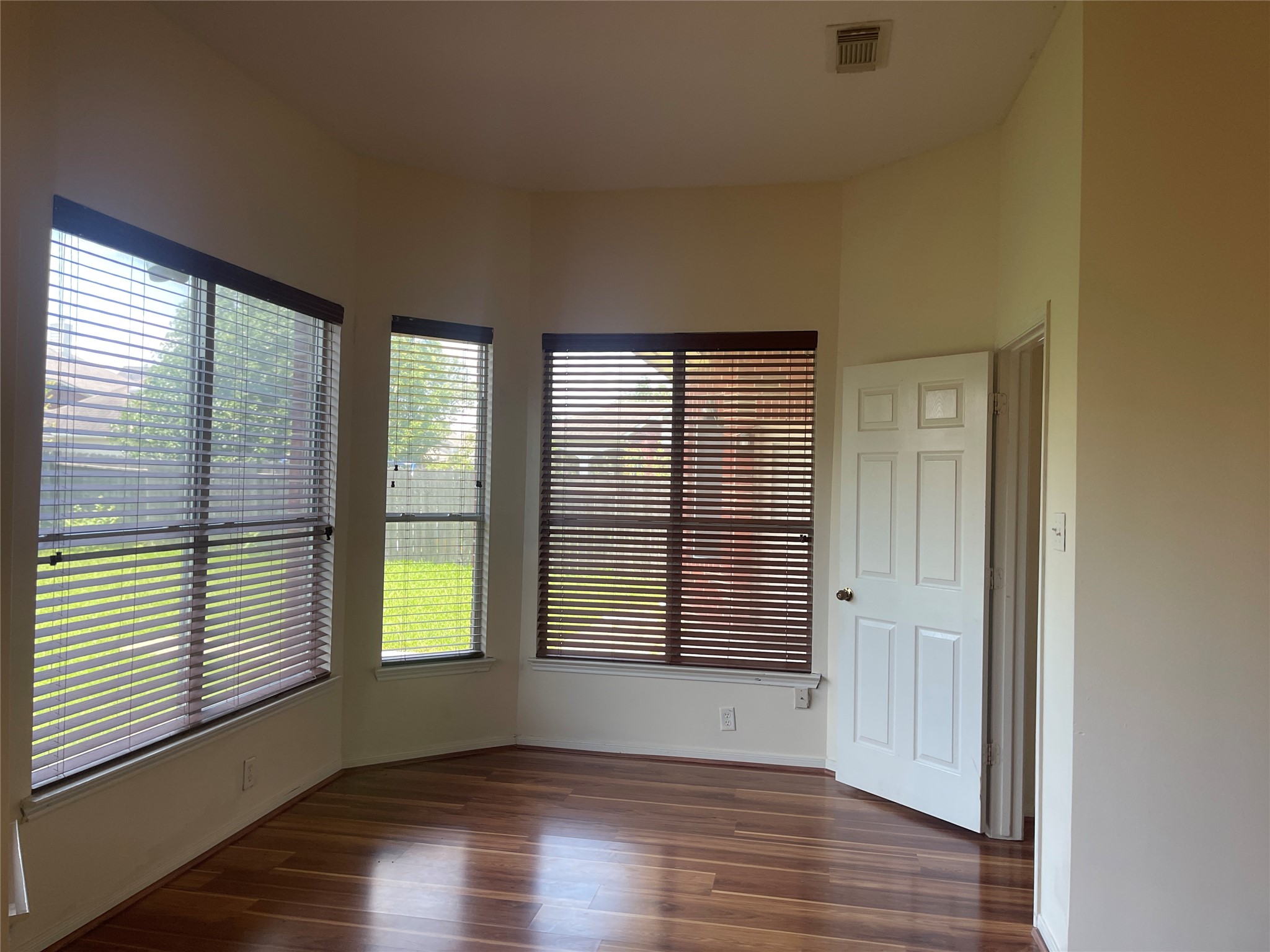 13113 Sunset Cliff Court Sugar Land, TX 77478 - Photo 8 of 22 an empty room with wooden floor and windows
