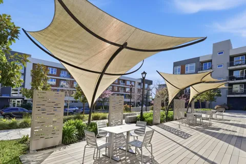 a view of a building with a backyard