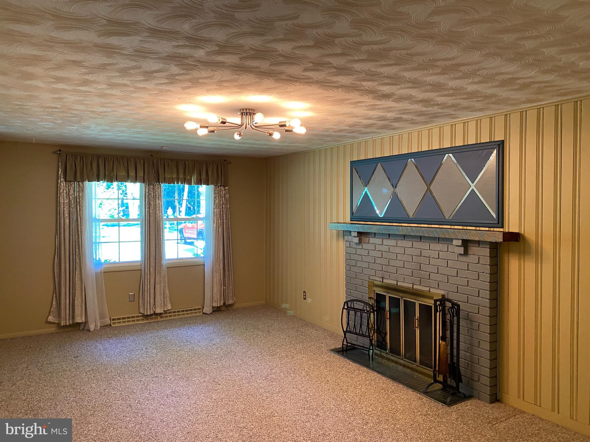 3807 Stoneybrook Road White Plains, MD 20695 - Photo 19 of 31 Wood-burning fireplace in Family Room off Kitchen.