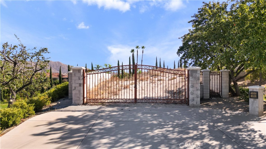 6204 Claridge Drive Riverside, CA 92506 - Photo 7 of 27 Private gate with walled perimeter