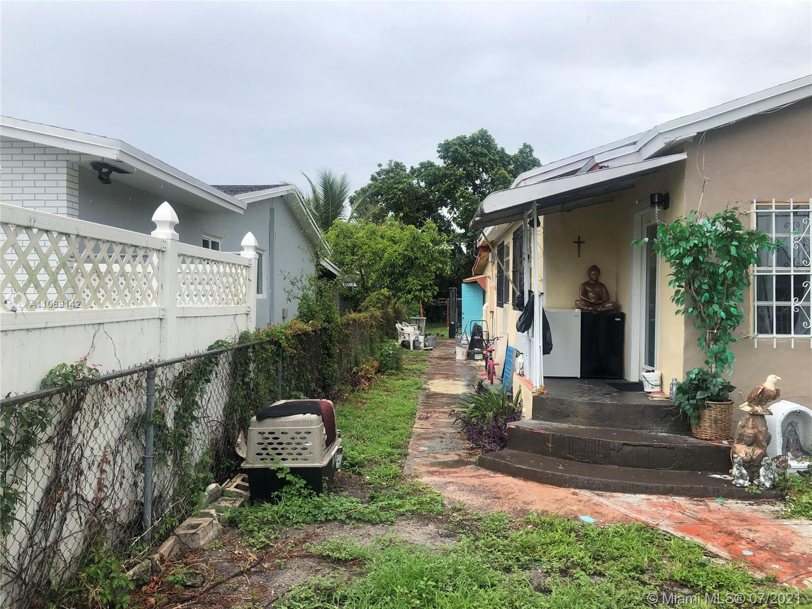 2925 Northwest 96th Street Miami, FL 33147 - Photo 4 of 11 a front view of a house with garden