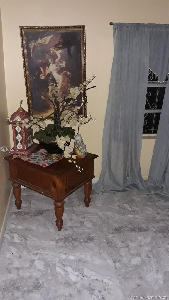 2925 Northwest 96th Street Miami, FL 33147 - Photo 6 of 11 a room with table and chairs