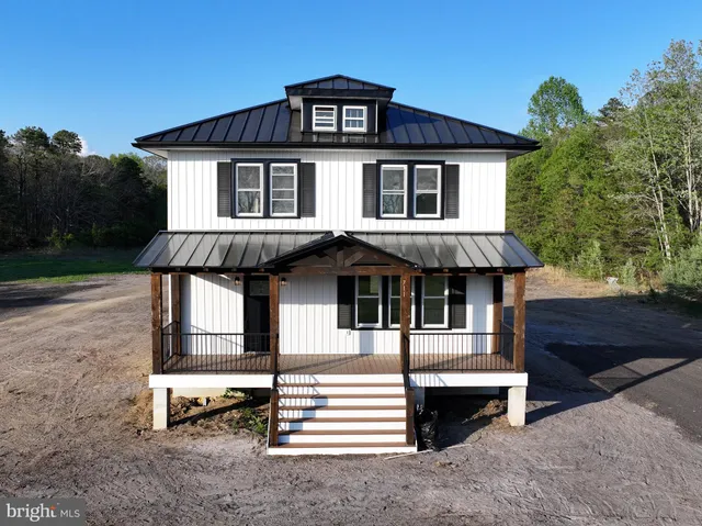 a front view of a house with a porch