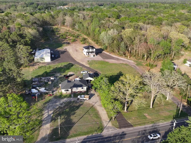 an aerial view of a house with outdoor space