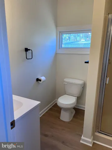 a view of wooden floor in a hall