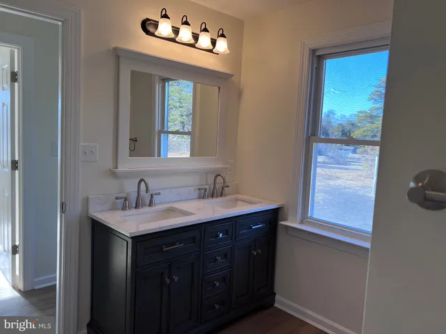 a bathroom with a toilet a sink and bathtub