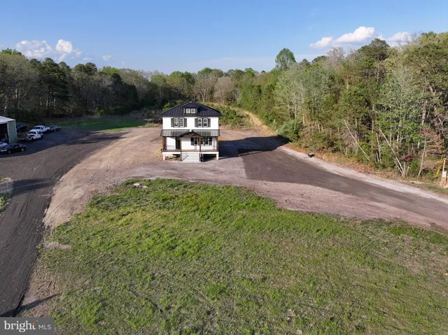 a view of a yard with a table and a fire pit