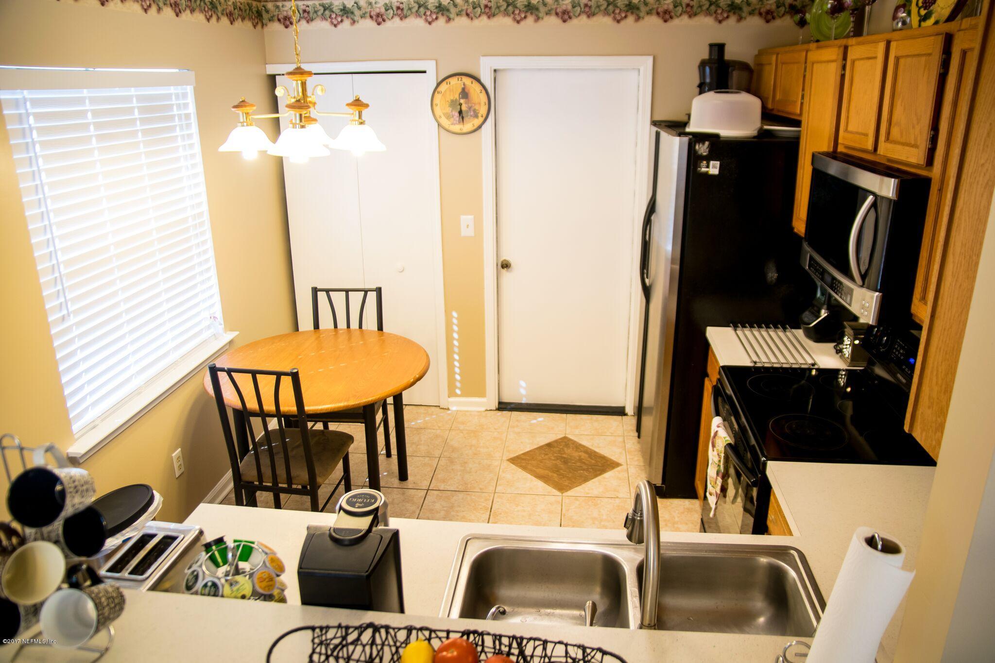 10775 Rutgers Road Jacksonville, FL 32218 - Photo 10 of 10 a bathroom with a sink and a mirror