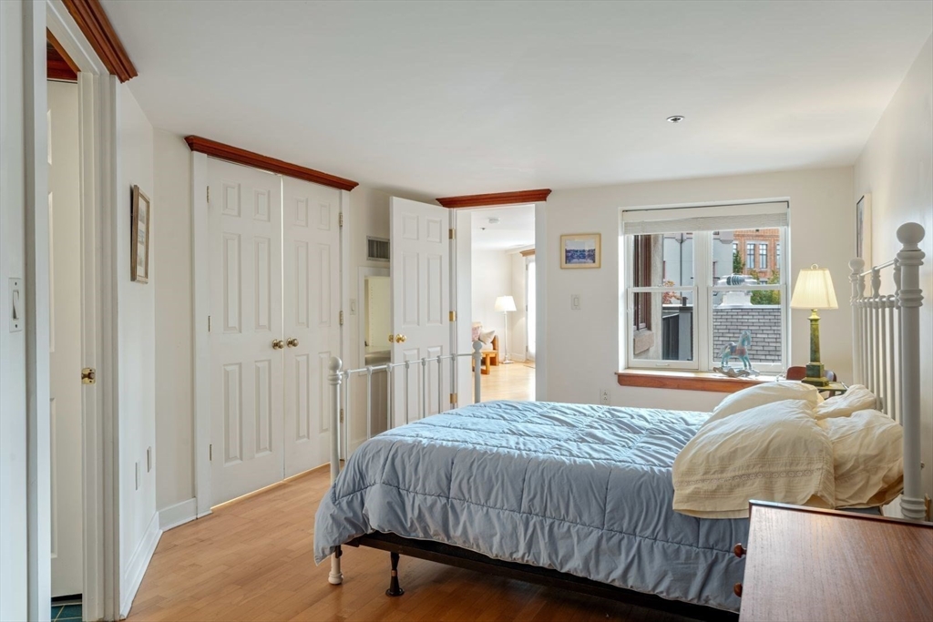 100 Fulton Street, Unit 4V Boston, MA 02109 - Photo 18 of 42 a bedroom with a bed and a closet