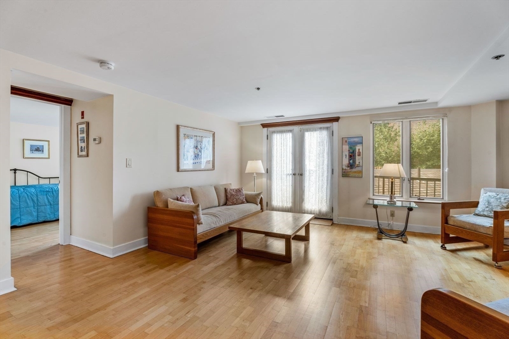 100 Fulton Street, Unit 4V Boston, MA 02109 - Photo 21 of 42 a living room with furniture and a wooden floor