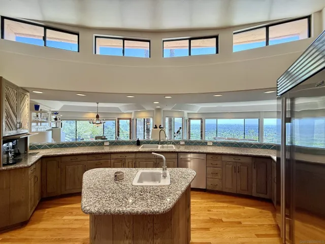 a kitchen with counter top space and appliances