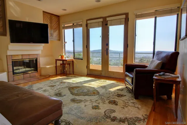 a bedroom with a bed and a television