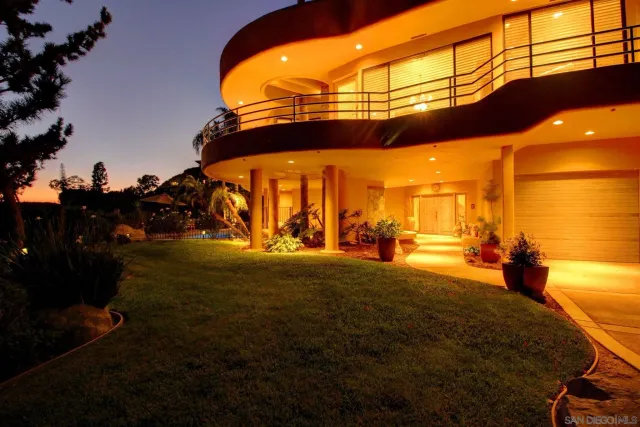 a view of an chairs in the backyard