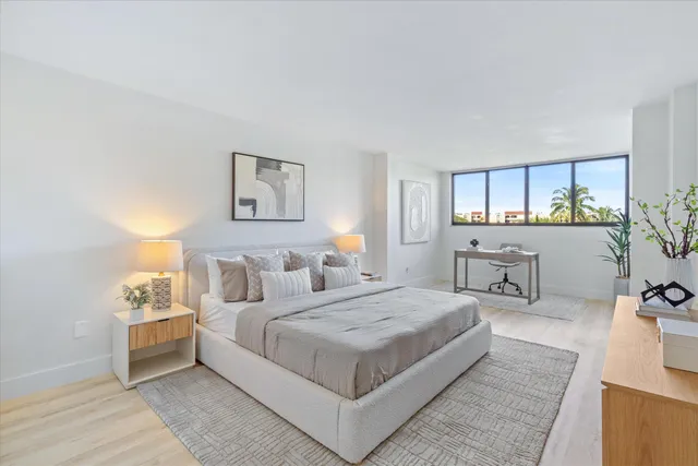 a bedroom with a bed and white walls