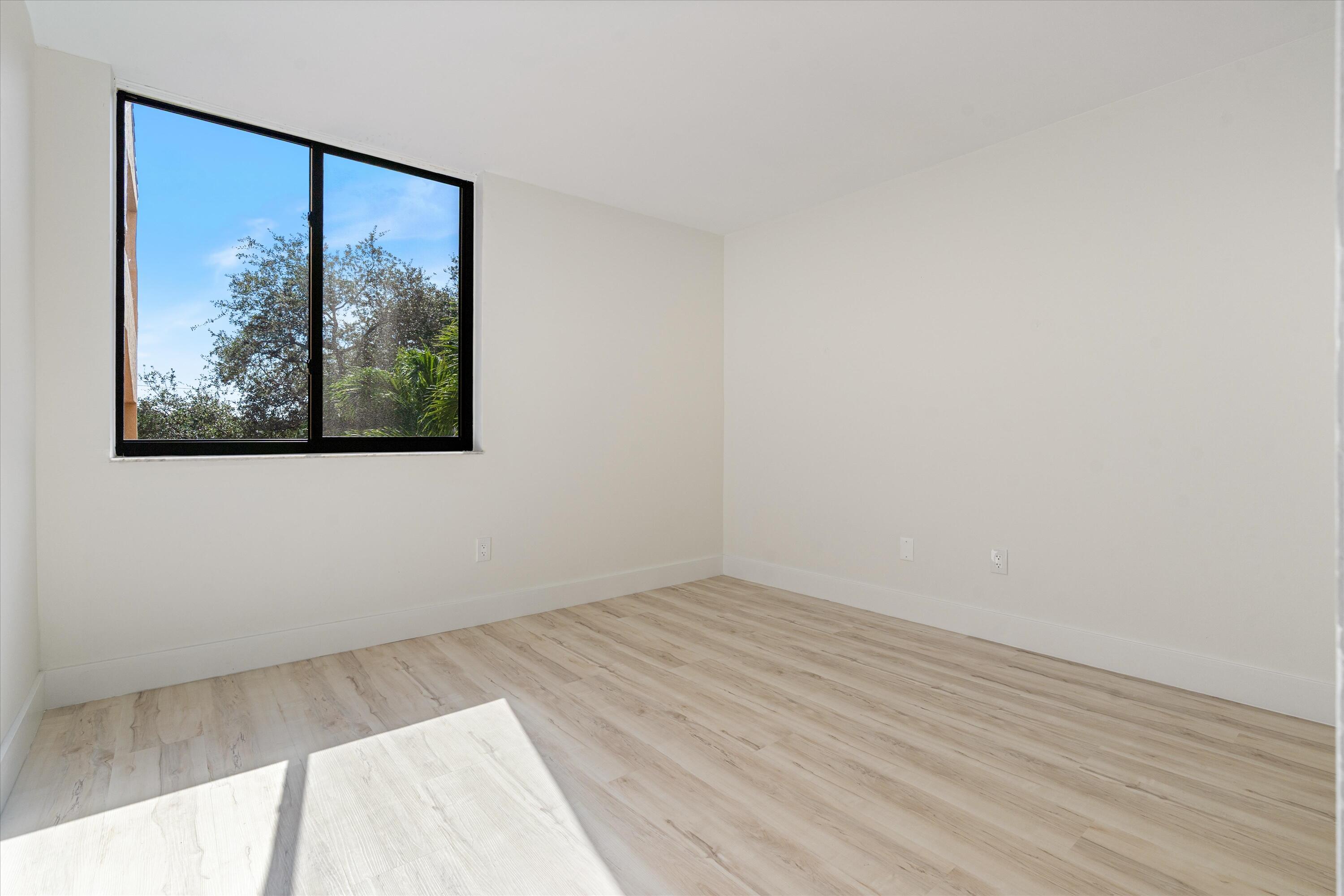 755 Dotterel Road, Unit 1307 Delray Beach, FL 33444 - Photo 19 of 36 a view of a small space with wooden floor and a window