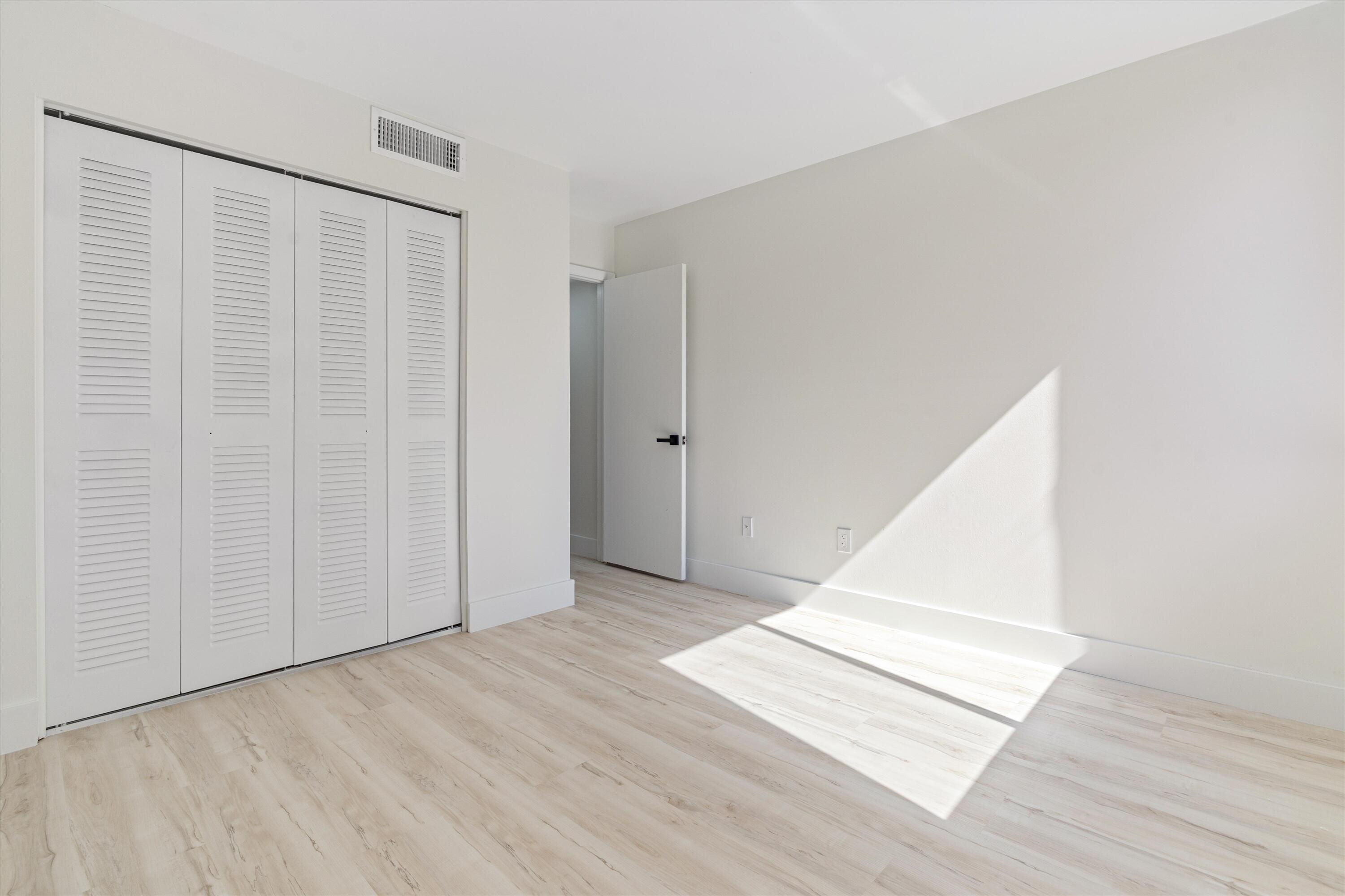 755 Dotterel Road, Unit 1307 Delray Beach, FL 33444 - Photo 20 of 36 a view of a big room with wooden floor and entryway