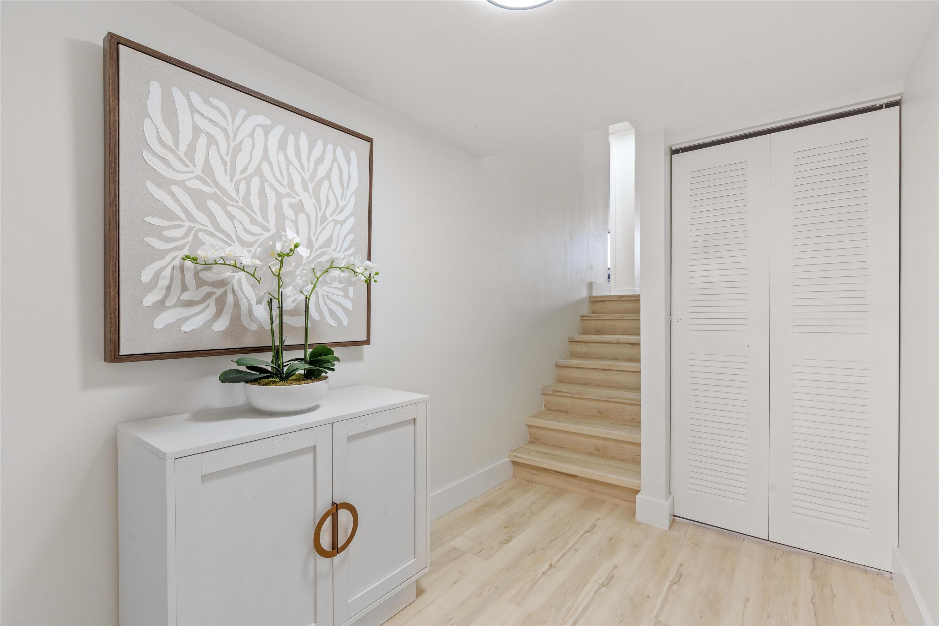 755 Dotterel Road, Unit 1307 Delray Beach, FL 33444 - Photo 2 of 36 a view of front door with wooden floor
