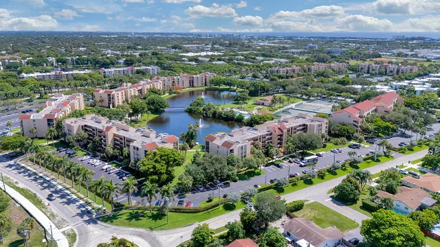 an aerial view of lake and residential houses with outdoor space