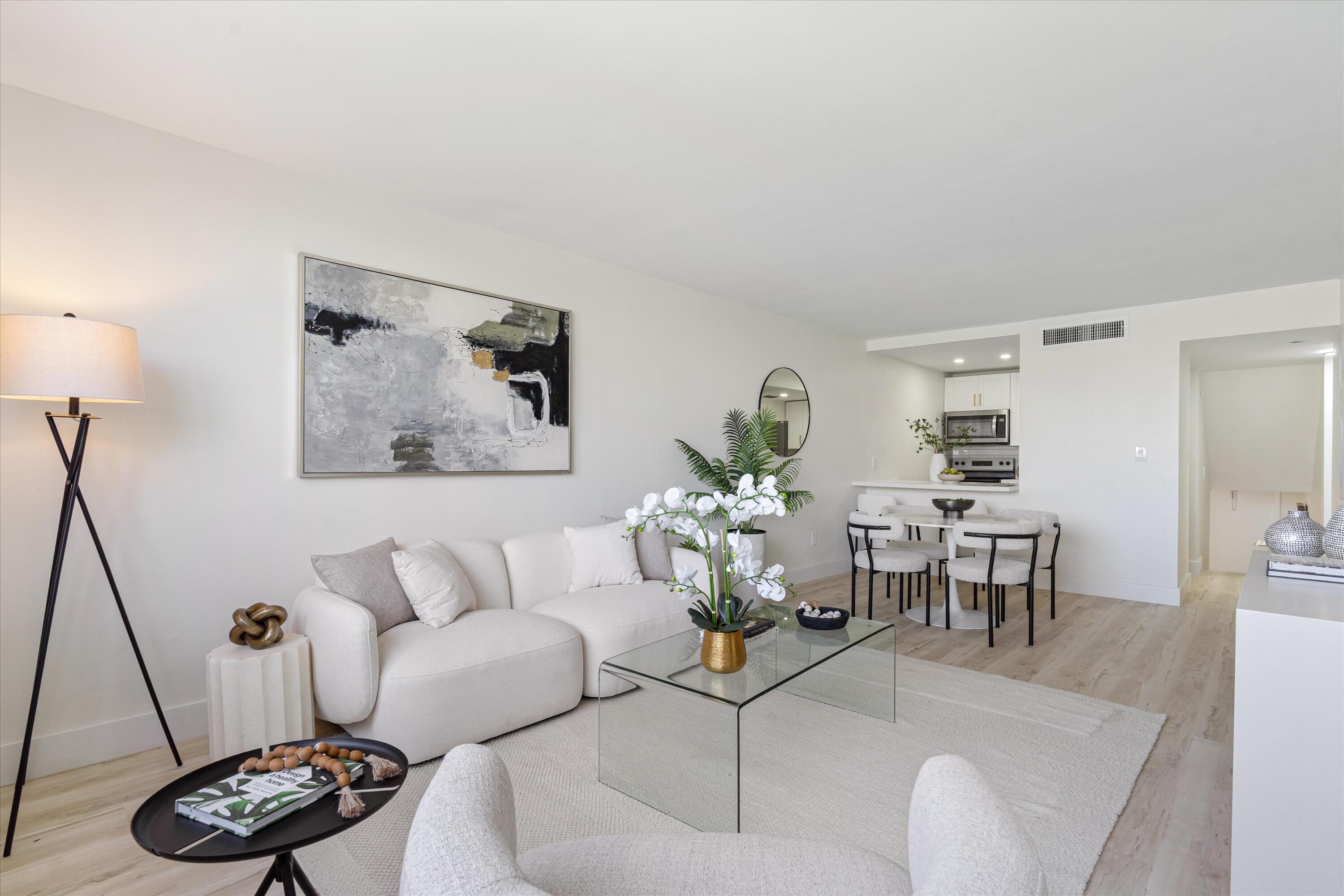 755 Dotterel Road, Unit 1307 Delray Beach, FL 33444 - Photo 4 of 36 a living room with furniture and a wooden floor