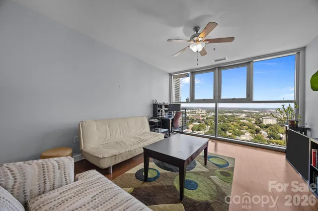 a living room with furniture and a large window