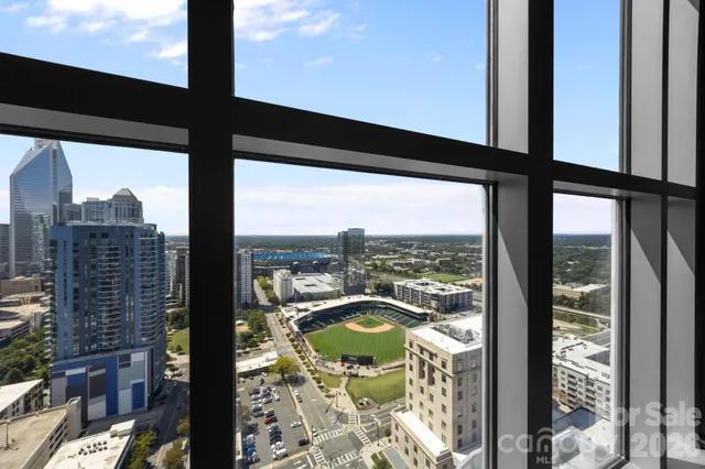 a kitchen with stainless steel appliances granite countertop a refrigerator sink and stove