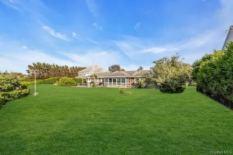 a view of a green field with clear sky