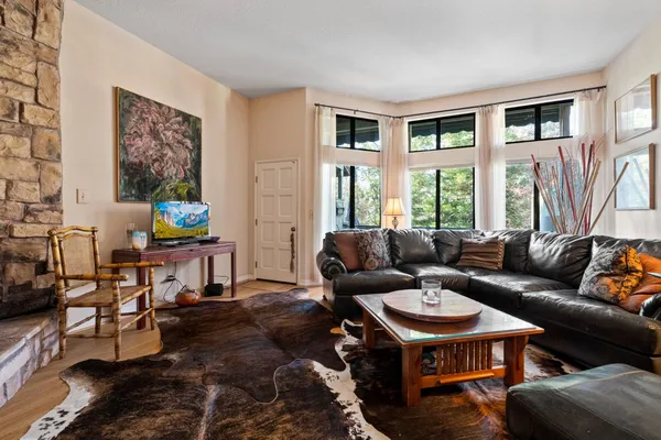 a living room with furniture and a large window