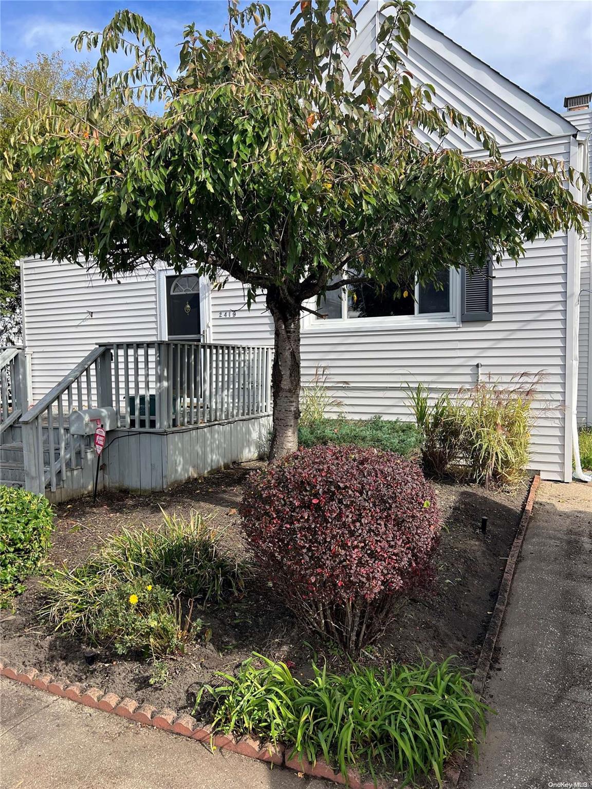 a house view with a garden space