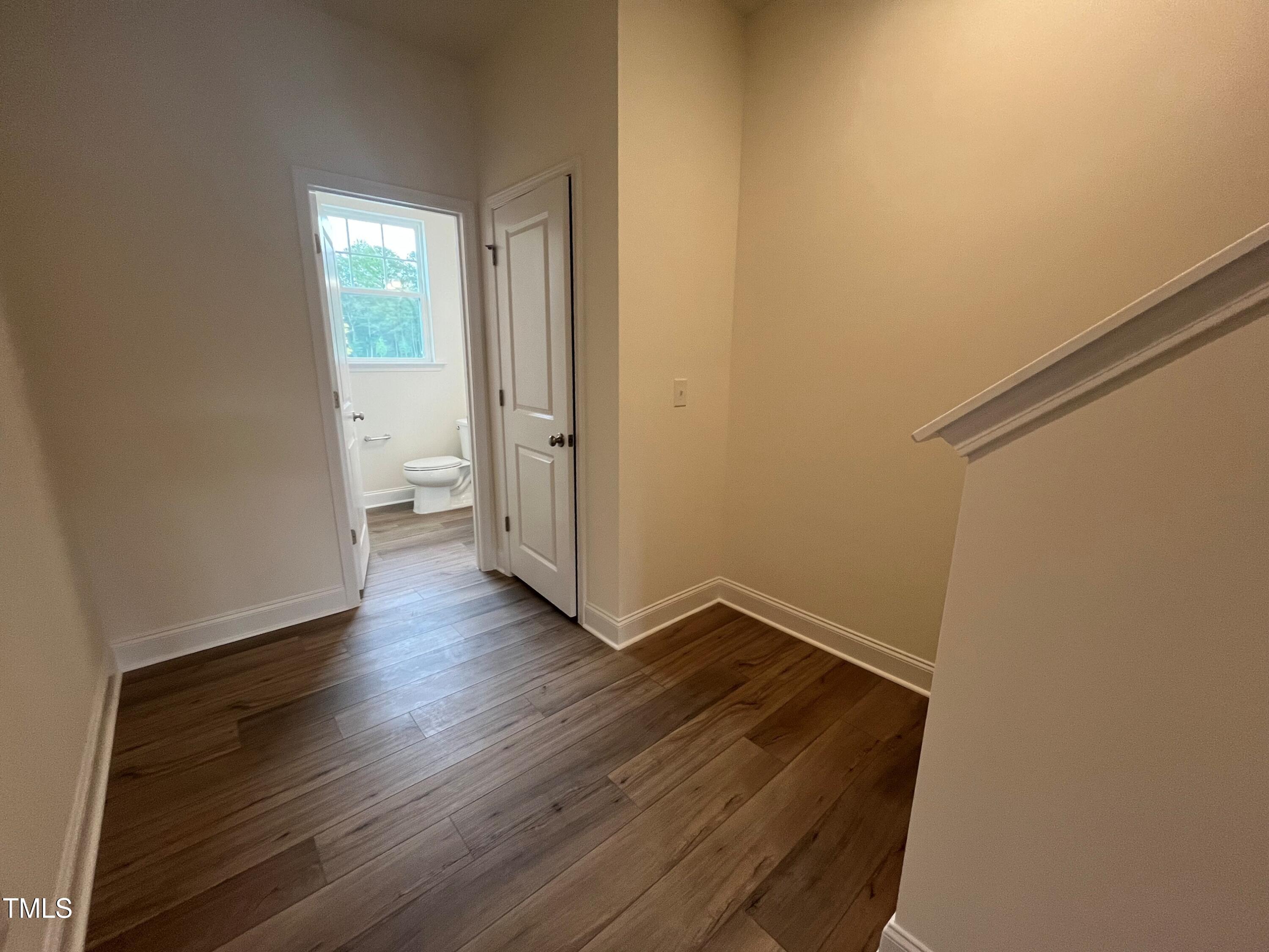 6123 Arsenal Avenue Raleigh, NC 27610 - Photo 13 of 56 Hallway leading to back staircase