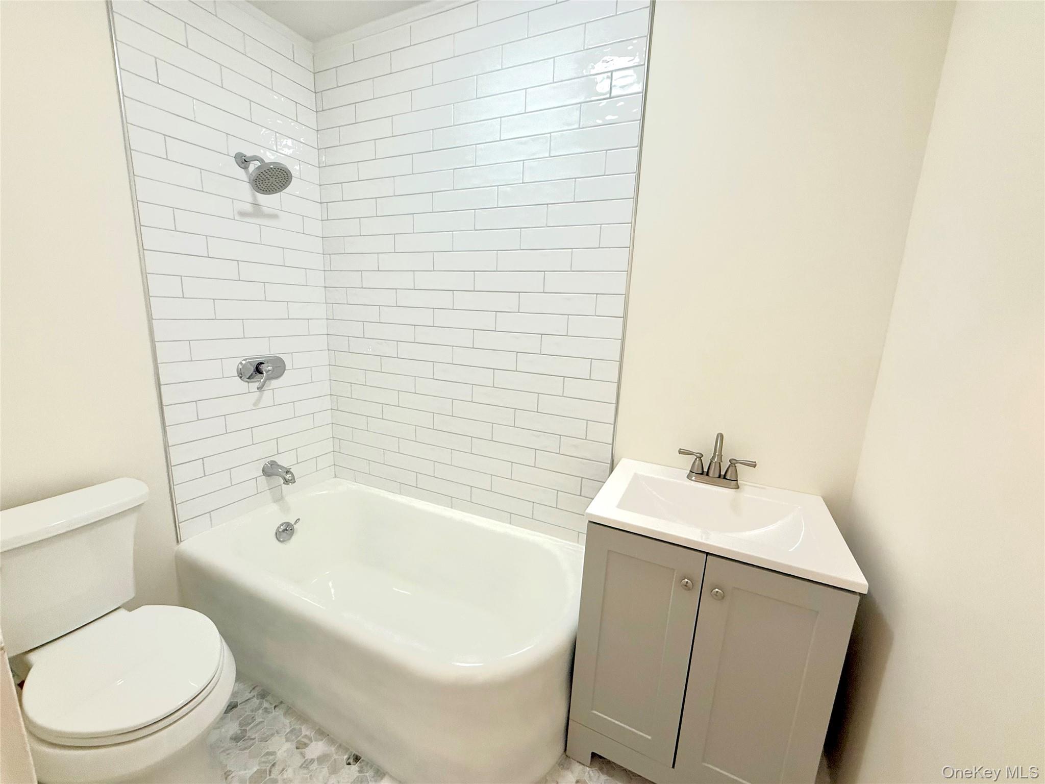 55 Red Mill Road Cortlandt Manor, NY 10567 - Photo 11 of 20 a bathroom with a sink a toilet and shower