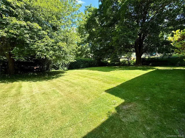 a swimming pool with wooden fence