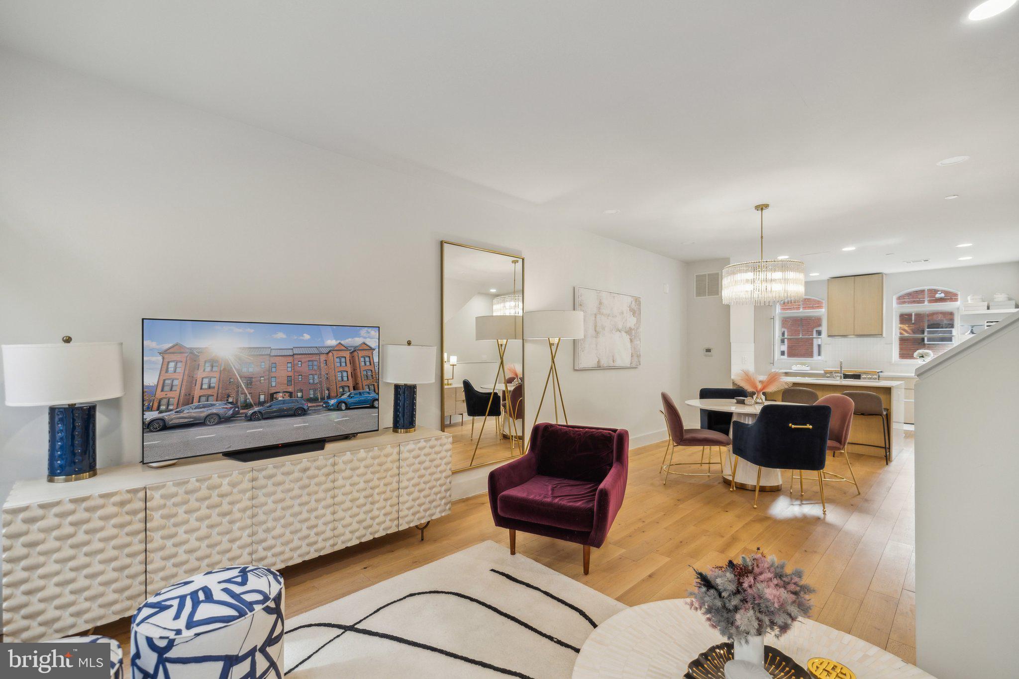 1309 E Street Southeast, Unit 36 Washington, DC 20003 - Photo 12 of 36 a living room with furniture and a flat screen tv