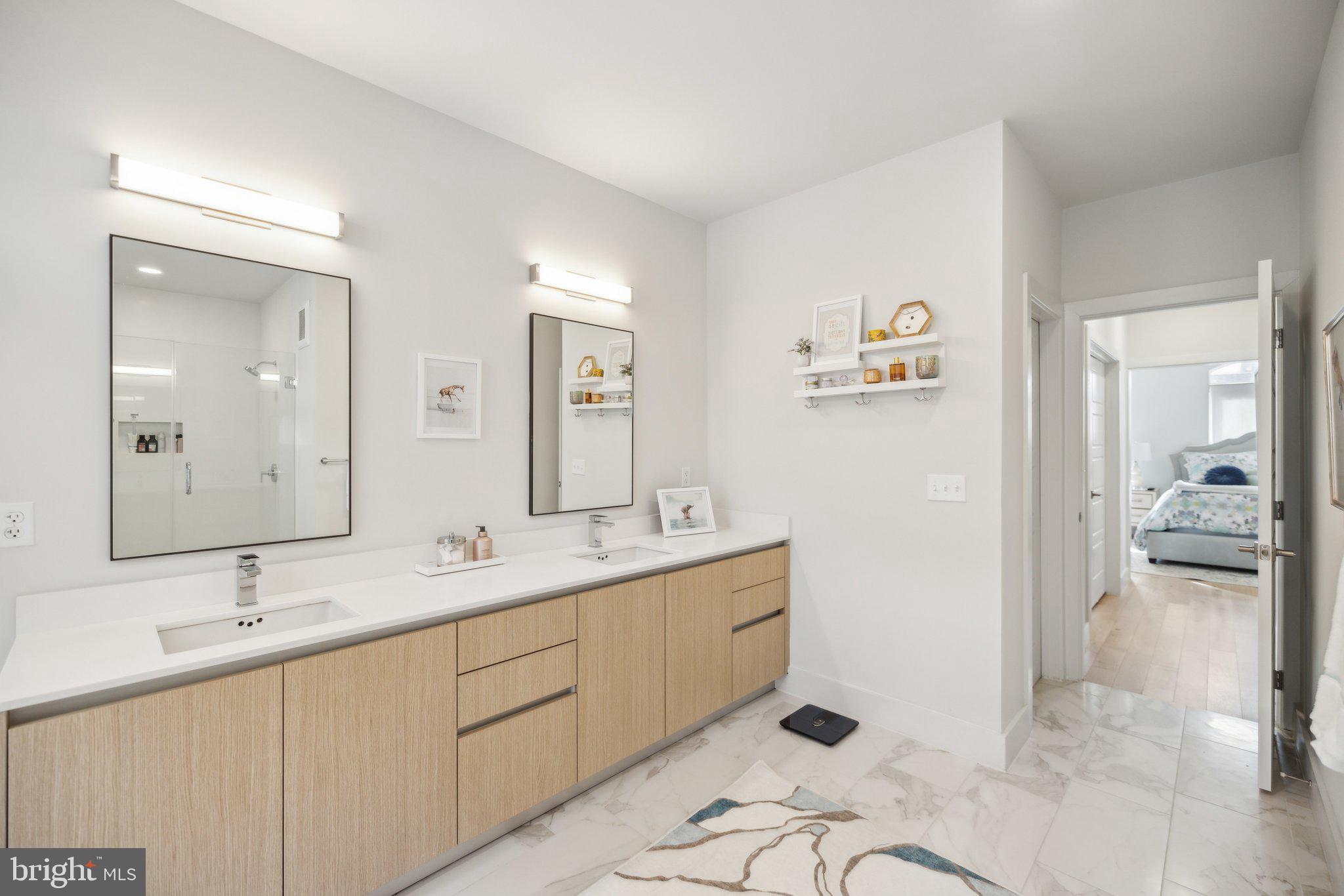 1309 E Street Southeast, Unit 36 Washington, DC 20003 - Photo 18 of 36 a en suite bathroom with a double vanity sink and mirror