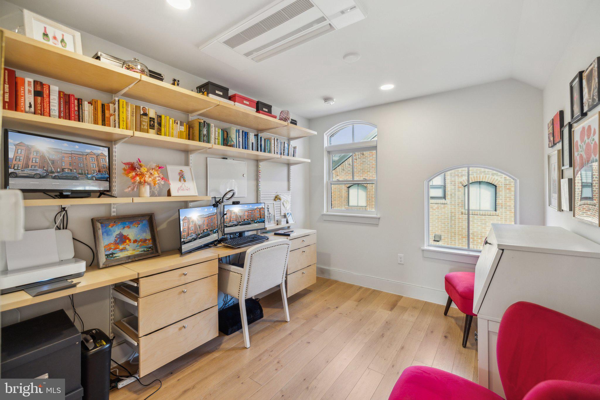 1309 E Street Southeast, Unit 36 Washington, DC 20003 - Photo 20 of 36 a living room with furniture and a book shelf