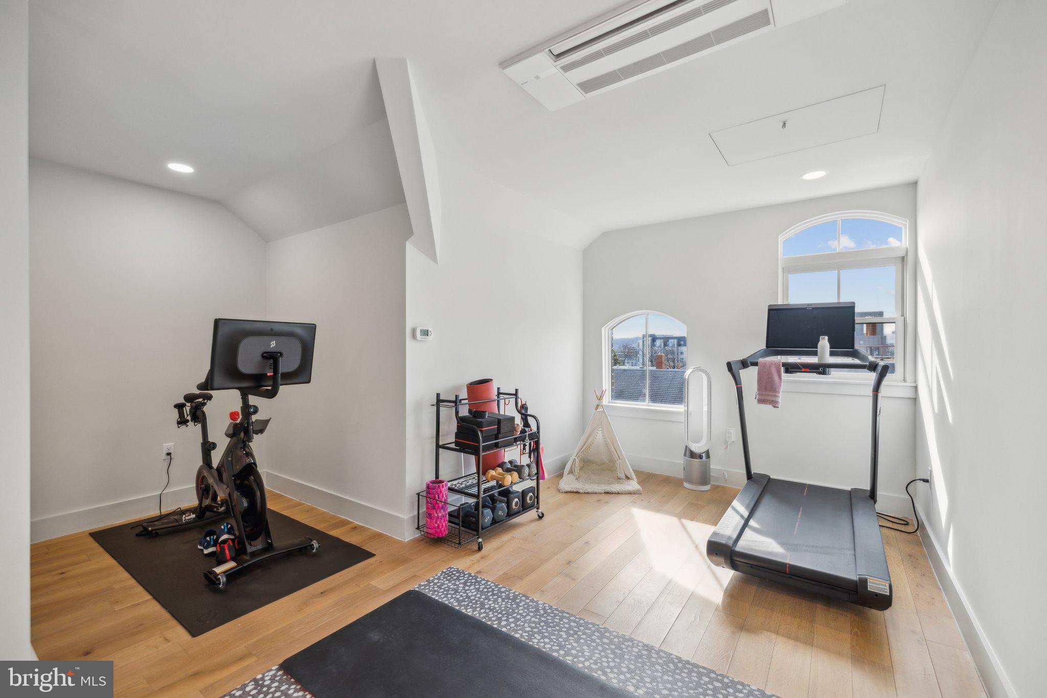 1309 E Street Southeast, Unit 36 Washington, DC 20003 - Photo 24 of 36 a room with gym equipment and a view of living room