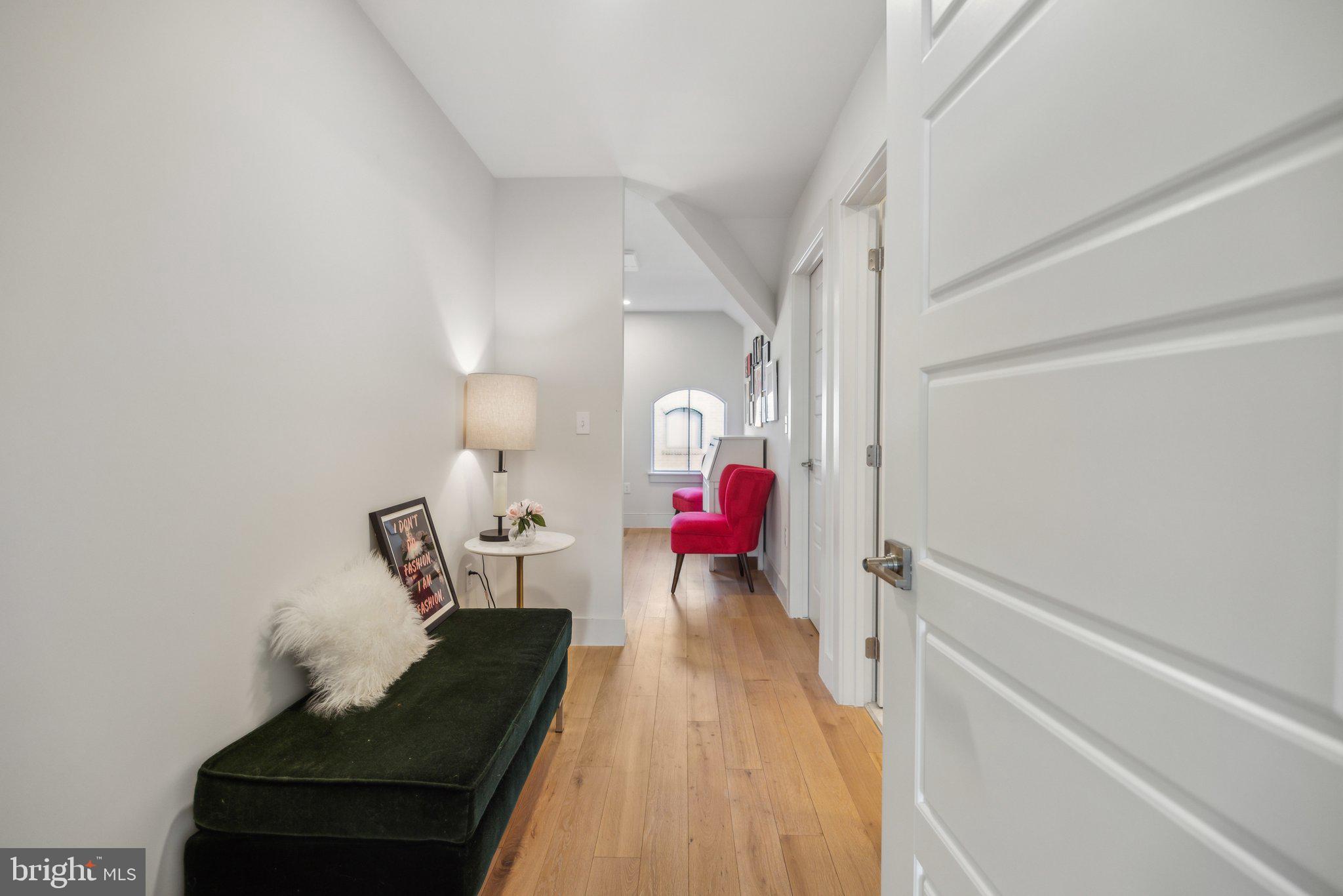 1309 E Street Southeast, Unit 36 Washington, DC 20003 - Photo 28 of 36 a living room with furniture and a wooden floor