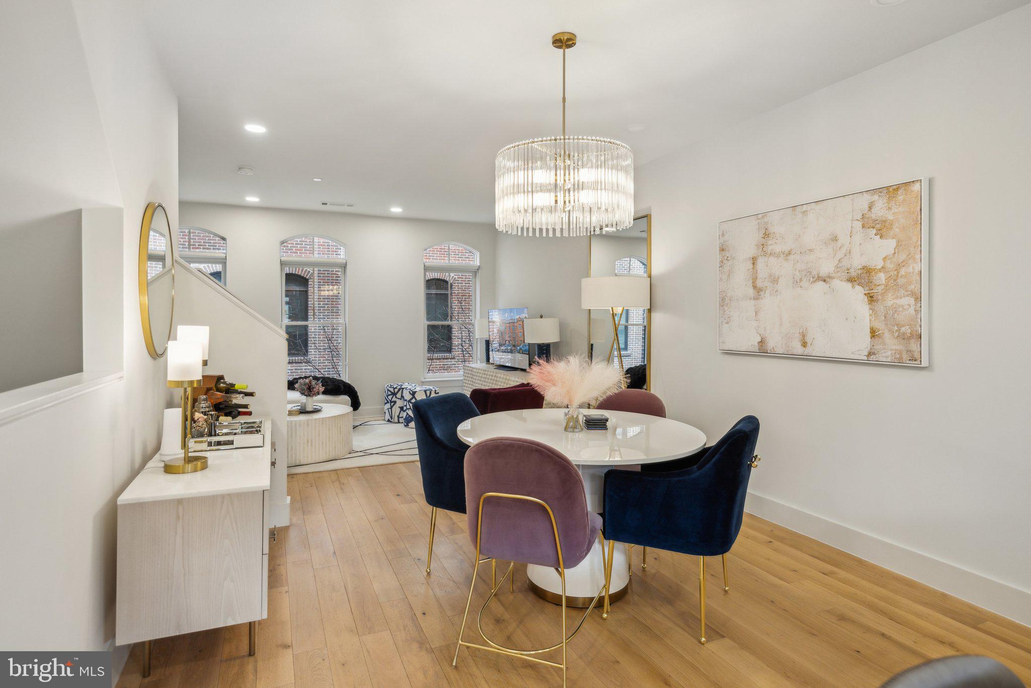 1309 E Street Southeast, Unit 36 Washington, DC 20003 - Photo 8 of 36 a view of a dining room with furniture a chandelier and wooden floor