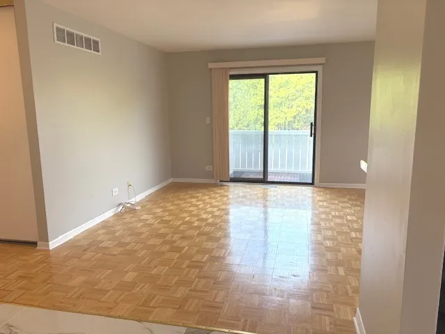 a view of an empty room and window