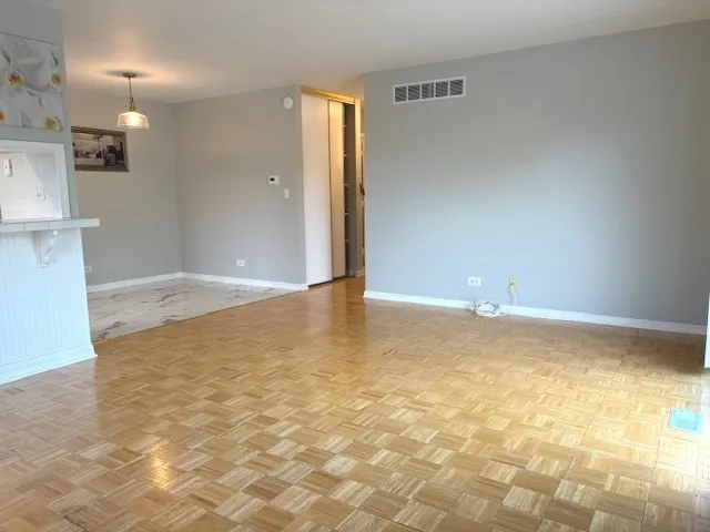 a view of a livingroom with wooden floor