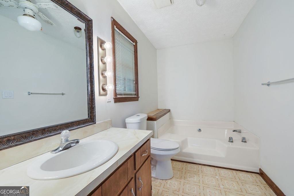 2733 Old Dawsonville Road Gainesville, GA 30506 - Photo 21 of 40 a bathroom with a sink toilet and shower