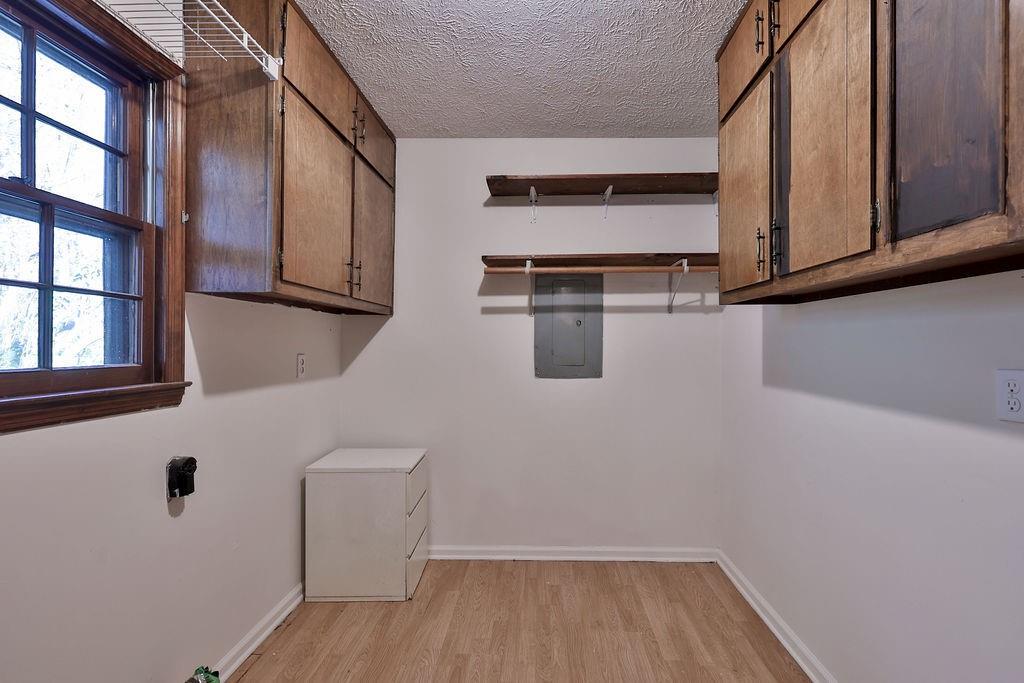2733 Old Dawsonville Road Gainesville, GA 30506 - Photo 4 of 40 a view of washer and dryer with wooden floor